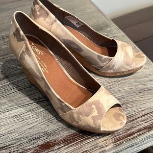 TOM’s open- toe camouflage wedge.  NWOT.